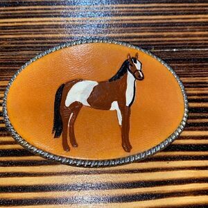Leather and painted horse belt buckle